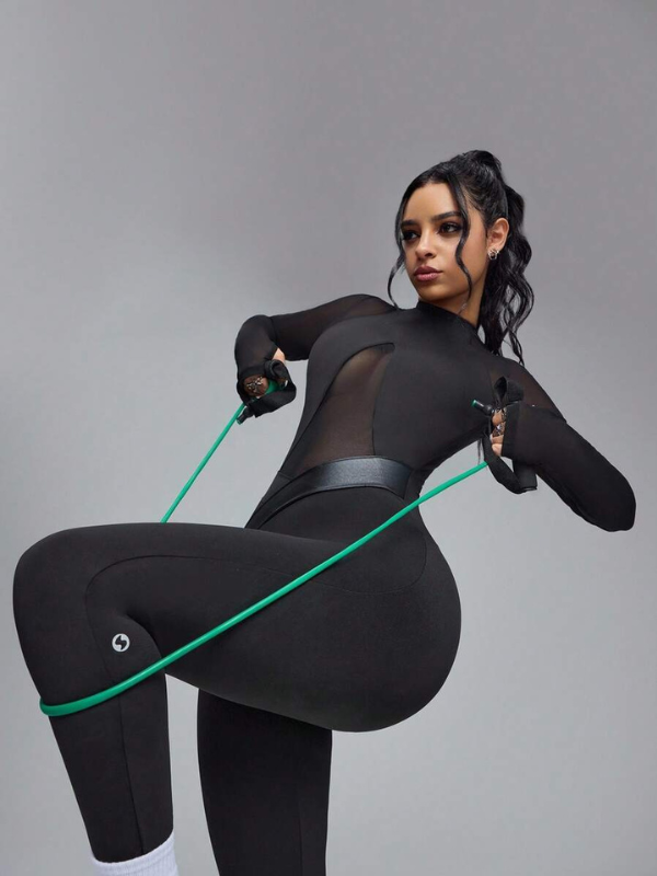 Naadmaastricht | Slim-fit Jumpsuit met PU-leren Mesh Panelen en Lange Mouwen